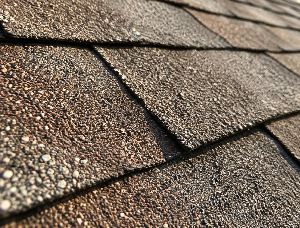 Close view of aging asphalt shingles